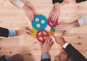 Business,Team,Connect,Pieces,Of,Gears.,Teamwork,,Partnership,And,Integration